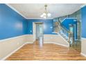 Dining area featuring hardwood floors and staircase at 745 Birchberry Sw Ter, Atlanta, GA 30331