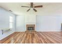 Bright living room featuring a fireplace and hardwood floors at 745 Birchberry Sw Ter, Atlanta, GA 30331