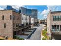 Street view of modern townhouses with balconies and attached garages in a well-maintained community at 1626 Aldworth Se Pl, Atlanta, GA 30339