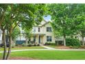 Inviting two-story home with manicured lawn, landscaped with mature shade trees at 3219 Colchester St, Douglasville, GA 30135