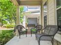 Inviting front porch with seating area to enjoy views of the landscaped front yard at 3219 Colchester St, Douglasville, GA 30135