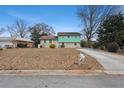 Charming home with a combination brick and vinyl exterior with a manicured front yard at 6100 Prestige Valley Rd, Morrow, GA 30260