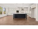 Spacious kitchen boasts an island, stainless steel appliances, and abundant natural light at 739 Marlay Sw Ln, Powder Springs, GA 30127