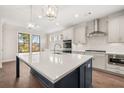Well-appointed kitchen features a large island, quartz countertops, and modern fixtures at 739 Marlay Sw Ln, Powder Springs, GA 30127