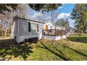 Charming home featuring a cozy front porch and well-maintained landscaping at 91 East Meadow Ln, Conyers, GA 30012