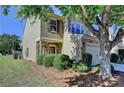 A charming exterior view of this inviting two-story home with lush greenery at 2505 Thackery Ct, Cumming, GA 30041