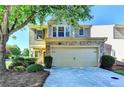 Charming two-story home with stone accents, a two-car garage, and mature trees enhancing curb appeal at 2505 Thackery Ct, Cumming, GA 30041
