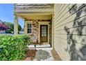 Inviting front porch with stone accents, a stylish front door, and manicured bushes for added curb appeal at 2505 Thackery Ct, Cumming, GA 30041