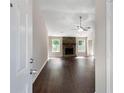 Inviting living room with dark hardwood floors and a stone fireplace at 102 River Oaks Dr, Woodstock, GA 30188