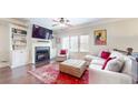 Comfortable living room features a fireplace, built-in shelving, and hardwood floors at 1263 Linden Ne Ct, Atlanta, GA 30329