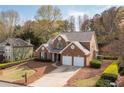 Charming two-story brick home featuring a two-car garage and well-maintained landscaping at 2269 Howell Farms Nw Trl, Acworth, GA 30101