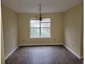 Inviting dining room with hardwood floors and a large window at 1119 Oakwood Manor Ct, Decatur, GA 30032