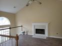 Spacious living room featuring a fireplace, ceiling fan and natural light at 1119 Oakwood Manor Ct, Decatur, GA 30032