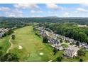 Breathtaking aerial view of a golf course community surrounded by lush greenery and rolling hills at 5415 Old Haven Ct, Cumming, GA 30041