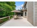 Spacious deck perfect for outdoor dining and relaxation, featuring an umbrella and comfortable seating at 5415 Old Haven Ct, Cumming, GA 30041