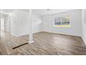 Spacious living space featuring new flooring and paint throughout, with a bright front door and large window at 4781 Brownsville Rd, Powder Springs, GA 30127