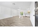 Open-concept living space with new flooring, modern lighting, and direct access to the updated kitchen at 4781 Brownsville Rd, Powder Springs, GA 30127