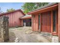 Entrance features wood door, stone accent, and walkway leading to well-maintained yard at 6134 Silver Spur Dr, Lithonia, GA 30058