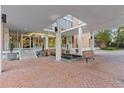 Elegant building entrance with brick pavers, benches, and a covered walkway at 130 26Th St # 706, Atlanta, GA 30309