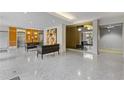 Spacious lobby with modern decor, including comfortable seating and mirrored walls at 130 26Th St # 706, Atlanta, GA 30309