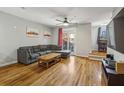 Spacious living room with hardwood floors, balcony access, and a comfortable couch for relaxation at 238 Walker # 39, Atlanta, GA 30313