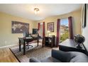 Comfortable home office with hardwood floors, natural light, and classic decor at 5020 Huntshire Sw Ln, Lilburn, GA 30047