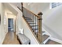Hallway with hardwood floors and staircase featuring decorative wood banisters at 606 Broadview Ne Ter, Atlanta, GA 30324