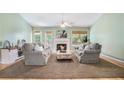 Cozy living room with neutral color palette, plush seating, fireplace, and lots of natural light at 1180 Chandler Ridge Dr, Lawrenceville, GA 30045