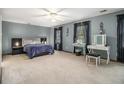 Serene main bedroom boasts natural light and a dressing table, creating a calming retreat within the home at 4754 Kelley Se Ct, Mableton, GA 30126