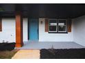 Inviting front porch featuring a bright blue front door and wood column at 4074 Green Hawk Trl, Decatur, GA 30035