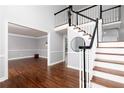 Bright foyer with hardwood floors and classic staircase at 4344 White Surrey Nw Dr, Kennesaw, GA 30144