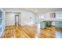 Open-concept area showcasing light wood floors and a kitchen ready for customization at 1760 Detroit Nw Ave, Atlanta, GA 30314