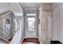 Inviting entryway with hardwood floors, a decorative mirror, and a bright, welcoming door at 2695 Ridge Run Trl, Duluth, GA 30097
