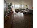 Bright living room features parquet floors, large windows, and comfortable seating at 3060 Pharr N Ct # 607, Atlanta, GA 30305