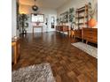 Spacious living room with hardwood floors, area rug and shelving at 3060 Pharr N Ct # 607, Atlanta, GA 30305