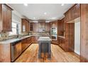 Gourmet kitchen featuring granite countertops, stainless steel appliances, and custom cabinetry at 2656 Old Norcross Rd, Tucker, GA 30084