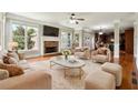 Bright and airy living room with fireplace, plush seating, and hardwood floors at 2656 Old Norcross Rd, Tucker, GA 30084