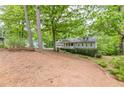 Home nestled amongst trees and landscaping at 2663 Marcia Dr, Lawrenceville, GA 30044
