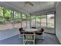 Cozy screened porch with outdoor seating, perfect for relaxing and enjoying the surroundings at 3003 Heavenly Ln, Snellville, GA 30078