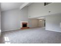 Spacious living room features a fireplace, neutral paint colors, and plush carpet at 785 Redland Dr, Jonesboro, GA 30238