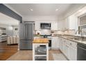 Bright kitchen with white cabinets, stainless steel appliances, and a butcher block island at 3013 Surrey Ln, Atlanta, GA 30341