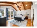 Serene main bedroom with vaulted wood ceilings, a ceiling fan, and access to a private balcony at 3013 Surrey Ln, Atlanta, GA 30341