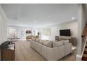 Spacious basement featuring a large sectional sofa, billiard table, and a wet bar, perfect for entertainment at 3686 Bills Cir, Atlanta, GA 30331
