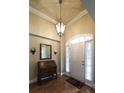 Inviting foyer with hardwood floors, decorative lighting, and a charming antique desk at 570 Highcrest Dr, Acworth, GA 30101
