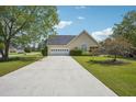 Inviting single-story home with a well-maintained lawn and attached two-car garage at 538 First St, Lawrenceville, GA 30046