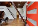 Inviting foyer with hardwood floors, staircase, vaulted wood ceilings, and modern lighting, creating a grand entrance at 3567 Beachhill Dr, Atlanta, GA 30340