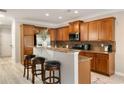 Bright kitchen area with granite countertops and breakfast bar at 690 Cobblestone Creek Ln, Mableton, GA 30126
