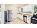 Bright kitchen with stainless steel appliances and granite countertops at 2044 Glendale Dr, Decatur, GA 30032