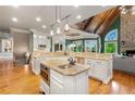 Spacious kitchen with granite countertops, stainless steel appliances, and center island with views of Gathering room at 2855 Drayton Hall Dr, Buford, GA 30519