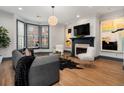 Beautiful living room showcasing a fireplace, large windows, and modern decor at 190 Centennial Way, Atlanta, GA 30313
